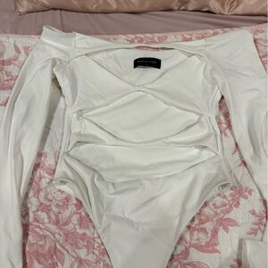 white fox body suit never worn